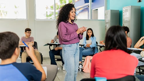 Teacher talking to students in circle 