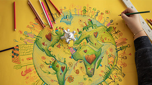 hand drawn map of the earth with colored pencils surrounding it