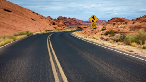 Road going through red rock formations