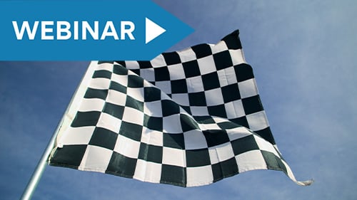 checkered finish line flag waving in the wind