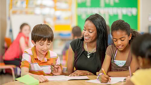 teacher helping multilingual learners