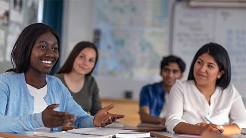 High school students having a discussion in a classroom